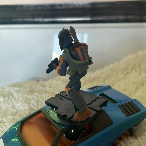 Action Figure on Blue Toy Car - Picture 4 of 6